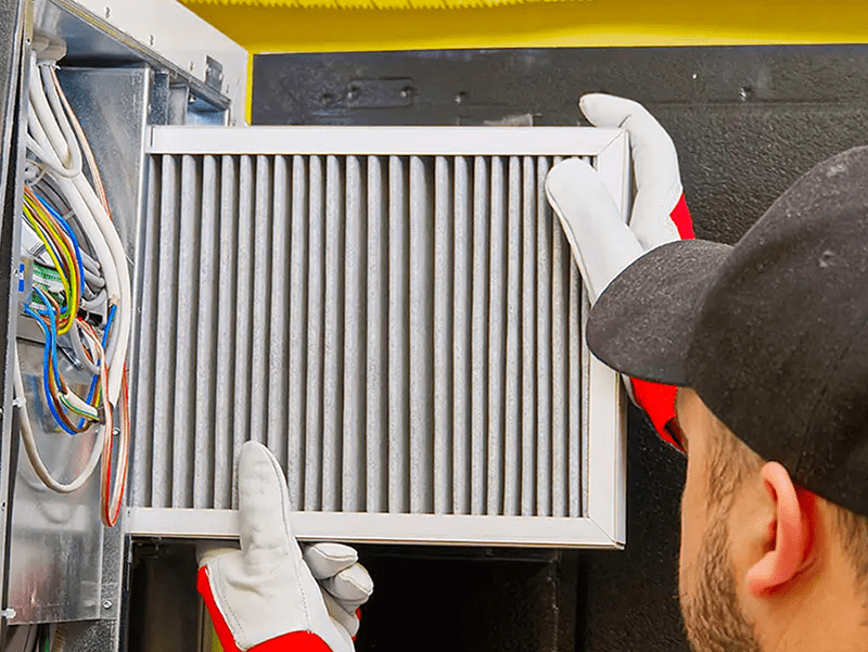 handyman changing air filter